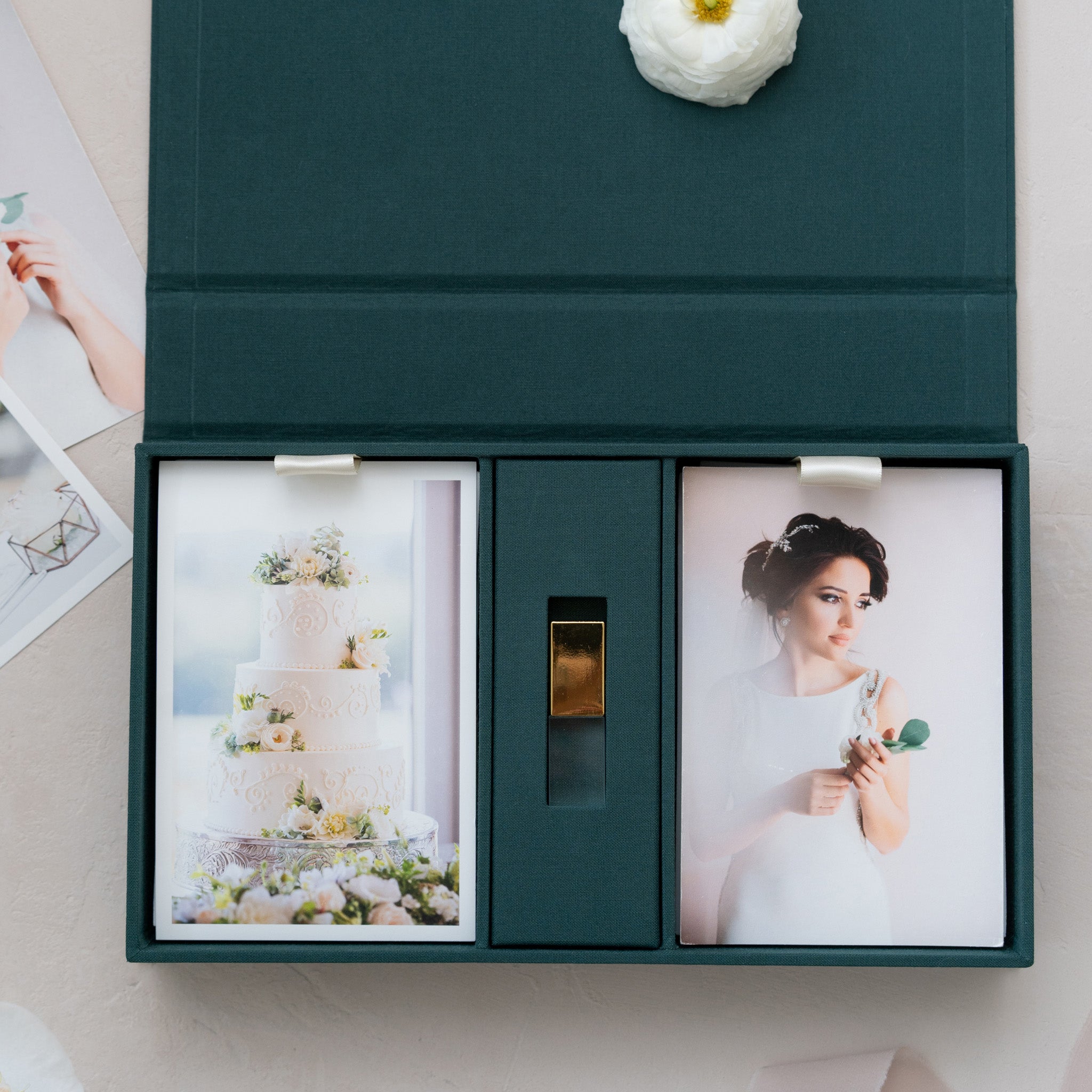 a green box with two photographs inside, one of a wedding cake and the other of a woman in a white dress.